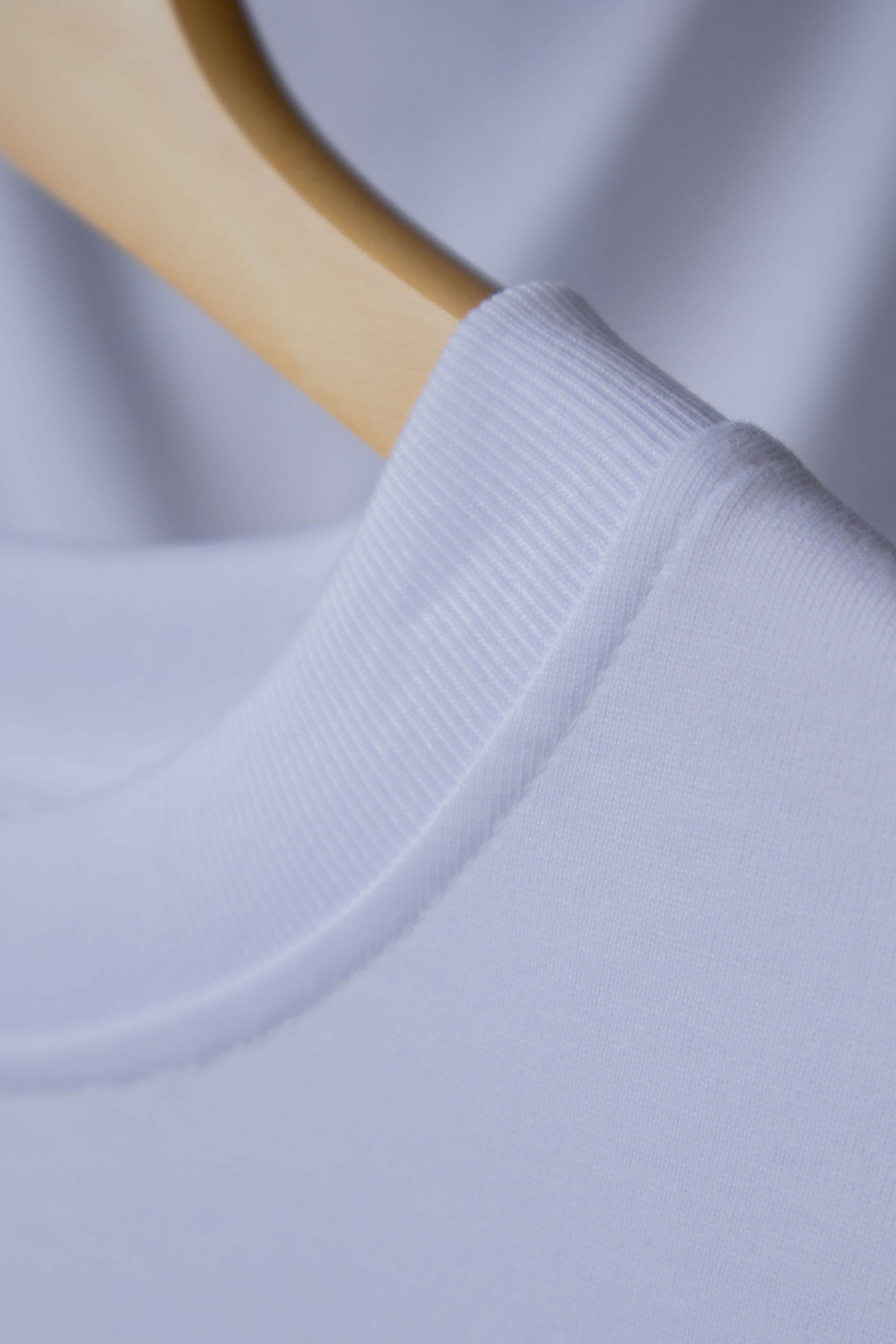 Close up on details for blank front white coloured ThreeFive T-shirt